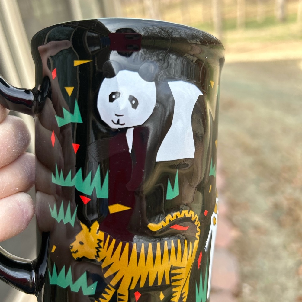 Black 3D coffee/tea mug. Featuring zoo animals.